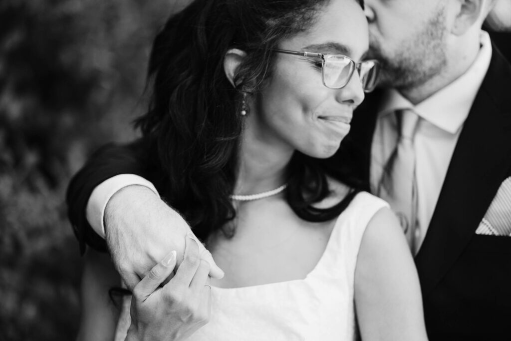 Bride and groom embracing and connecting on their wedding day, enjoying a stolen moment to themselves