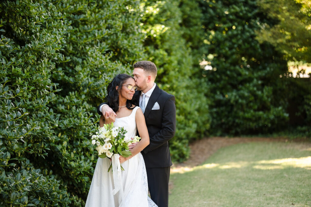 A couple embracing for a quiet moment together during the wedding day.