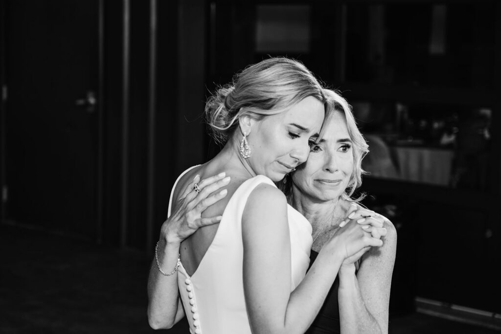 Bride dancing with her mom during the reception sharing a sweet and emotional moment.